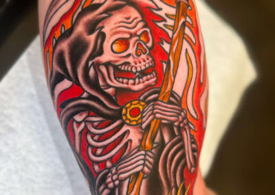 grim reaper skeleton with flames tattoo