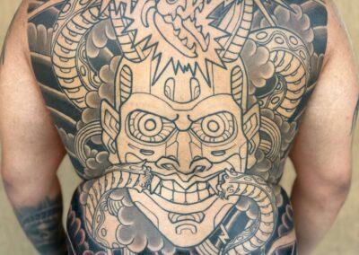 Japanese Traditional tattoo of biotechnic hannya mask and snake