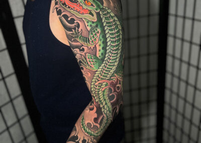 Japanese Traditional tattoo of an alligator with water full sleeve