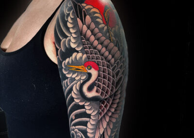 Japanese traditional tattoo of crane with red sun and windbars