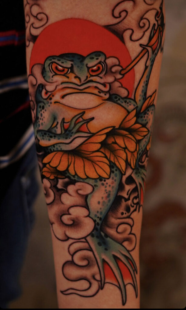 Japanese Traditional tattoo of frog or  kaeru with clouds symbolism 