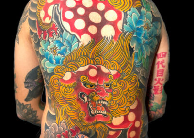 Japanese traditional tattoo full back piece of red fudog and blue peonies