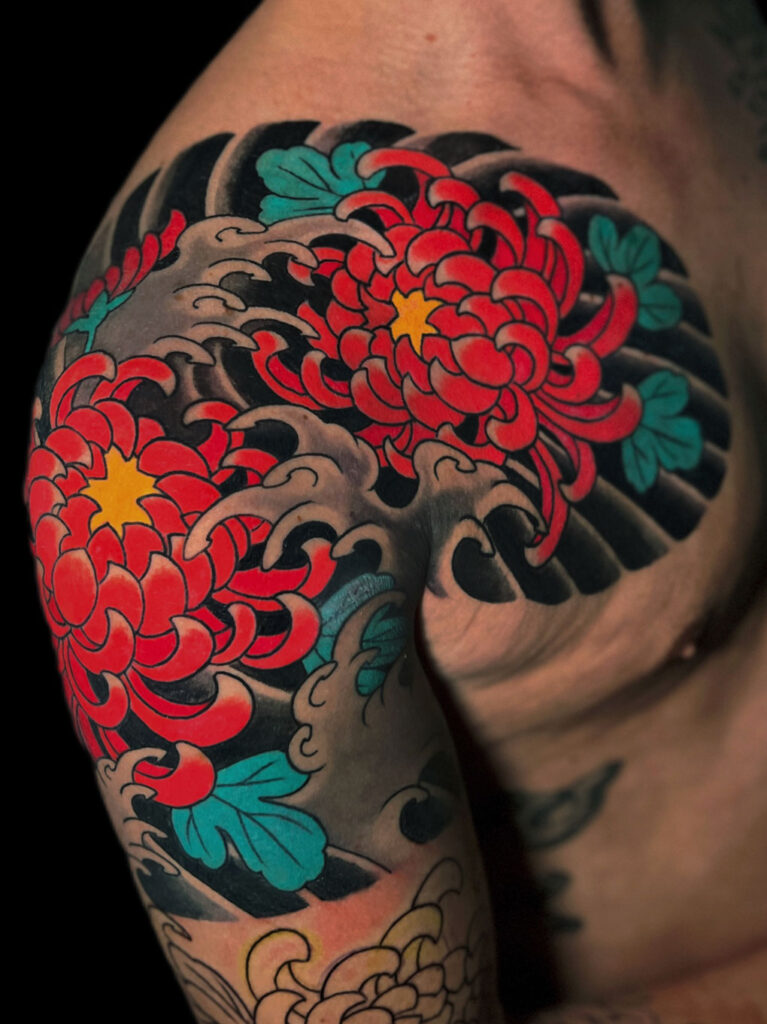 Japanese Traditional tattoo of red chrysanthemums quarter sleeve and chest panel
