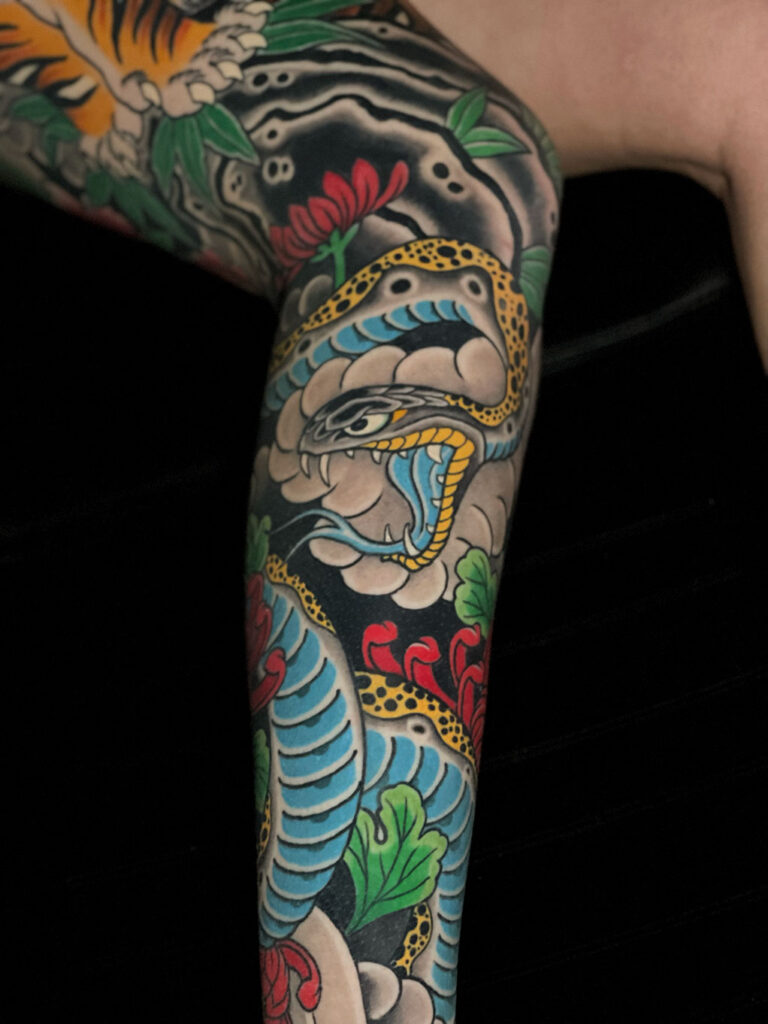 Japanese Traditional tattoo of yellow snake with blue belly leg sleeve