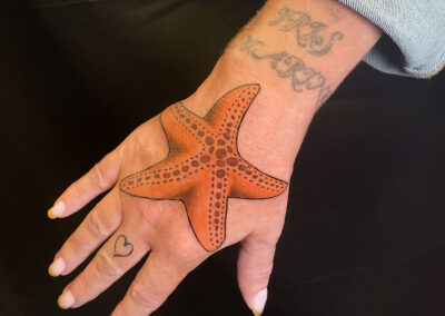 tattoo on hand of starfish