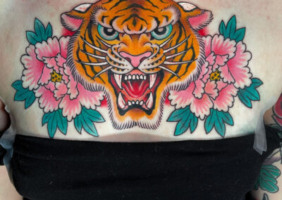 tattoo if tiger head and pink peonies