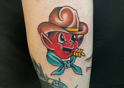 American traditional devil cowboy tattoo