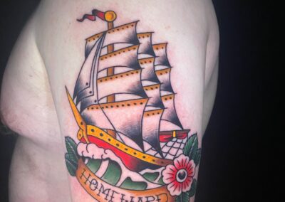 American traditional clipper ship with banner and flowers