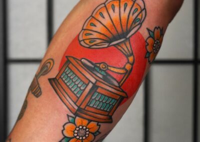 American traditional gramophone with flowers tattoo