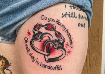 heart shaped handcuffs tattoo