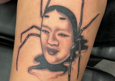 Japanese traditional jorogumo spider with face tattoo
