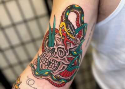 American traditional snake and skull tattoo