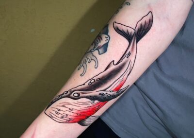 whale with red belly tattoo
