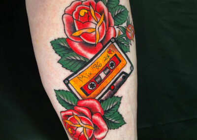 traditional cassette tape with roses tattoo