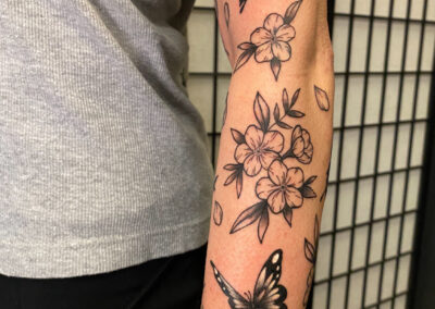 flowers with butterflies tattoo
